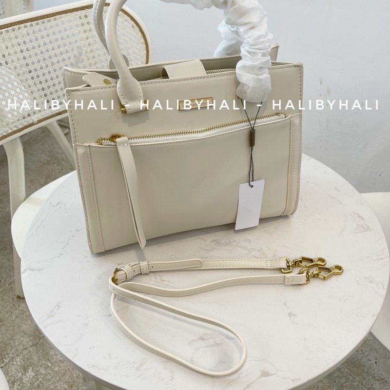 Túi cnk ngăn kéo trước có quai xách