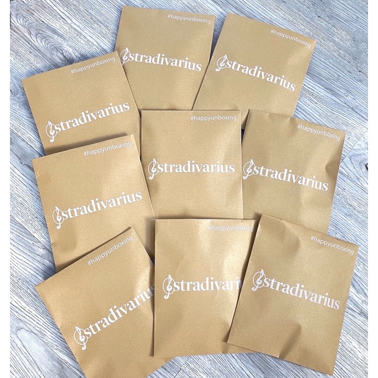 Chân váy xếp ly stra kèm túi giấy