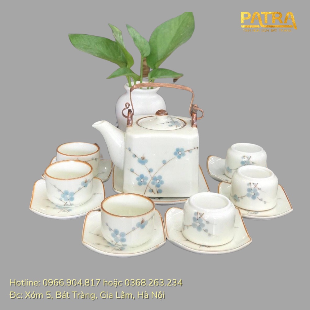Bộ ấm chén uống trà cao cấp , bộ ấm trà Bát Tràng men kem họa tiết hoa đào xanh quai đồng