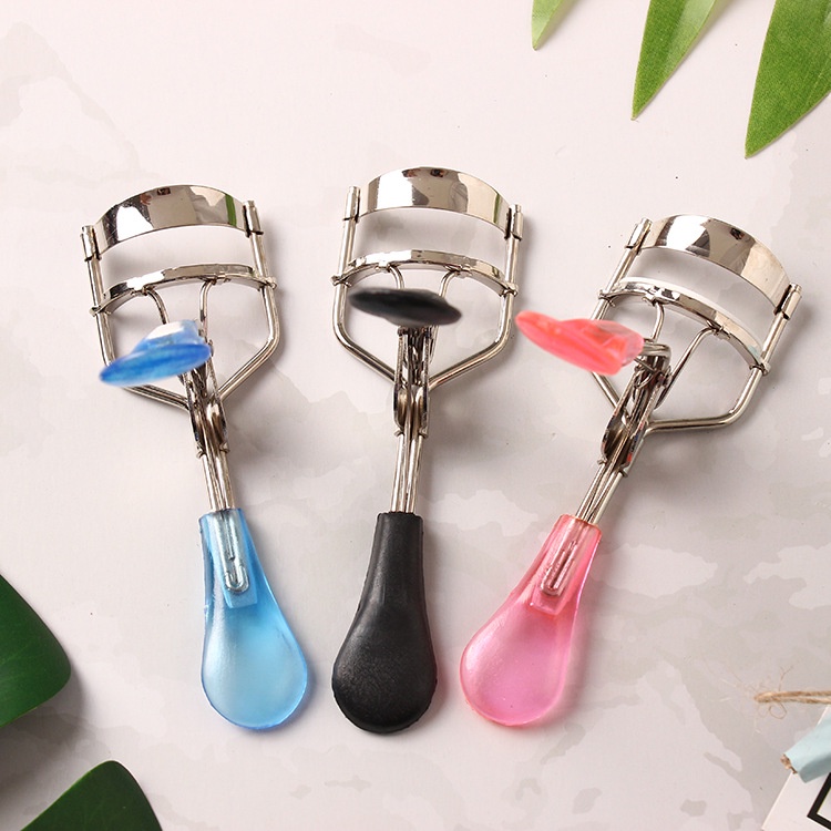 Multi-colored handle and padded eyelash curler