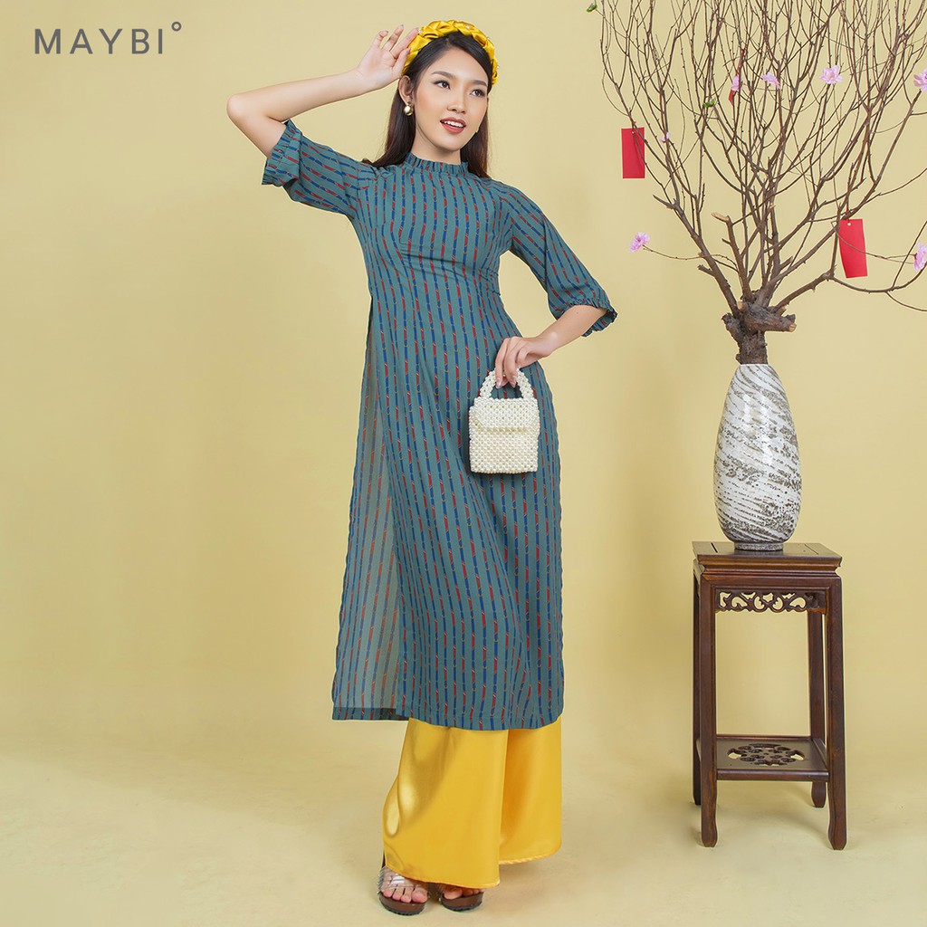 Áo dài Maybi hoạ tiết nền xanh lá đậm tay lửng phối bèo