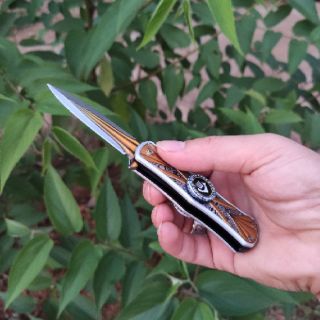Dao gấp spinner xoay 360