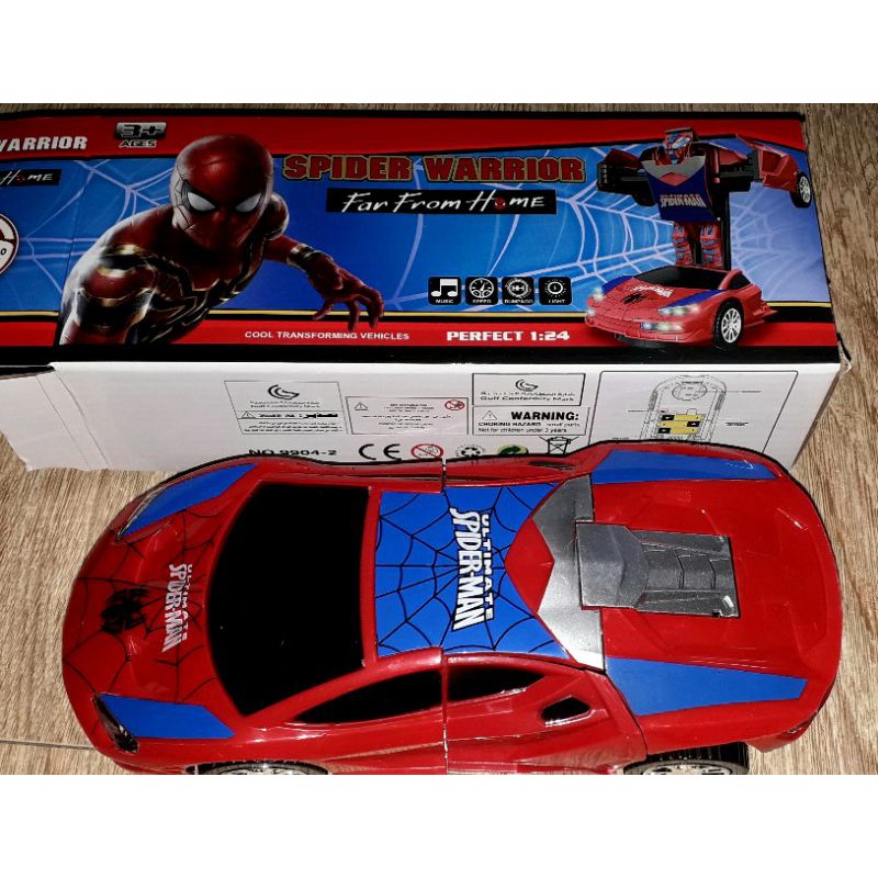Một chiếc xe chạy pin biến thành spiderWarrior có nhạc và đèn led_ tặng kèm pin