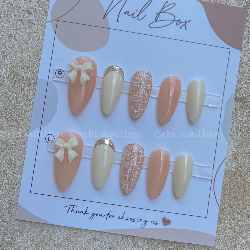 Móng úp thiết kế đính nơ thạch hồng cam trắng sữa kẻ dạ cebi.nailbox c049