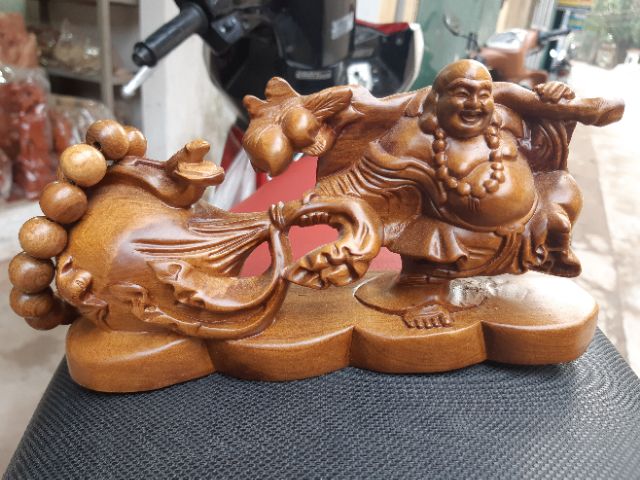 Tượng phật di lặc kéo bao gỗ bách
