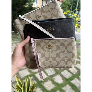 ví cầm tay Coach sz 20cm