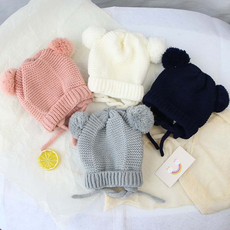 Mũ dệt kim mềm mại thiết kế hình tai thỏ phối quả bóng lông xù ấm áp màu trơn thiết kế dễ thương cho bé