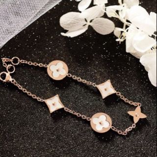 Lắc tay titan LV xà cừ