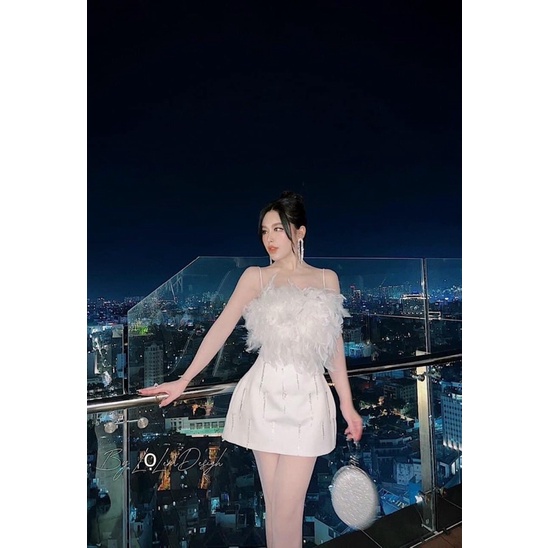 Đầm lông vũ dây đá tua rua