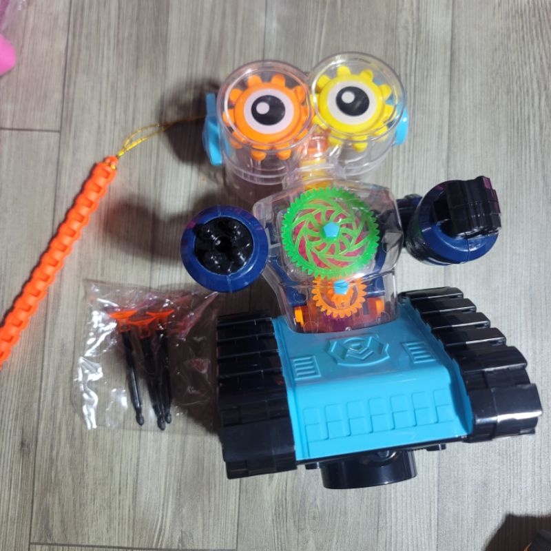Đồ chơi lồng đèn robot bánh răng lộ động cơ trong suốt bắn đạn cao su mềm độc lạ phát âm thanh,đèn cho trẻ em