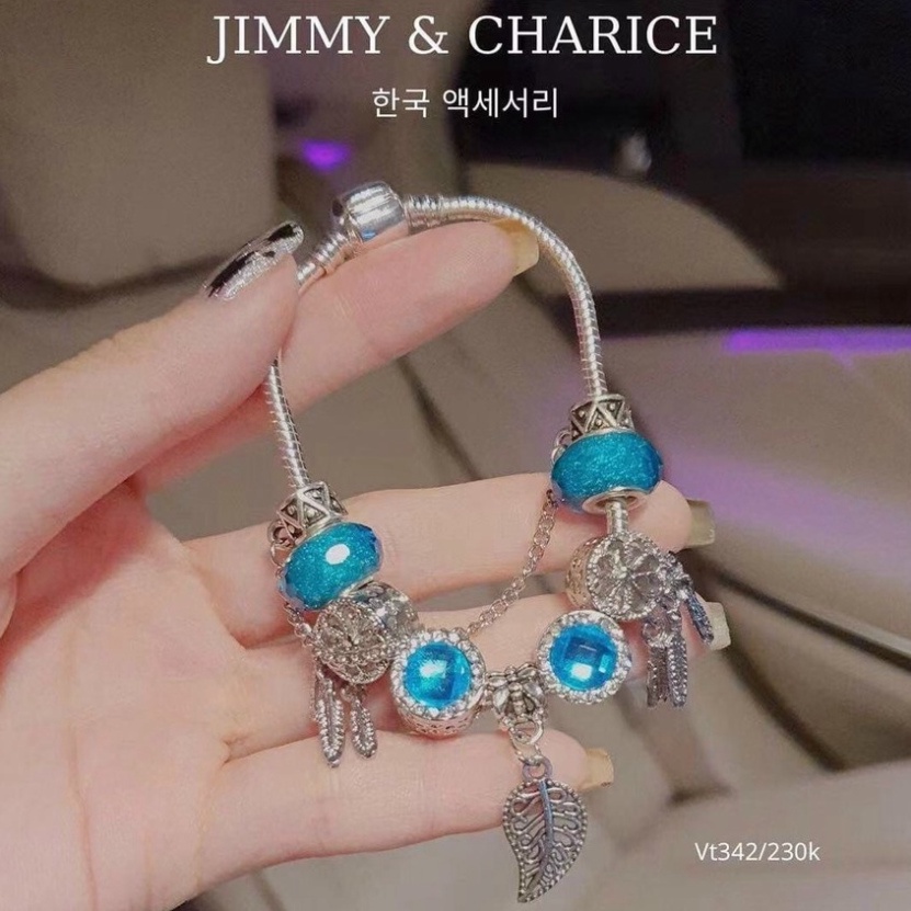 Vòng tay charm Jimmy & Charice  may mắn chất liệu titan mạ bạc không han rỉ bay tiếp xúc nước thoải mái