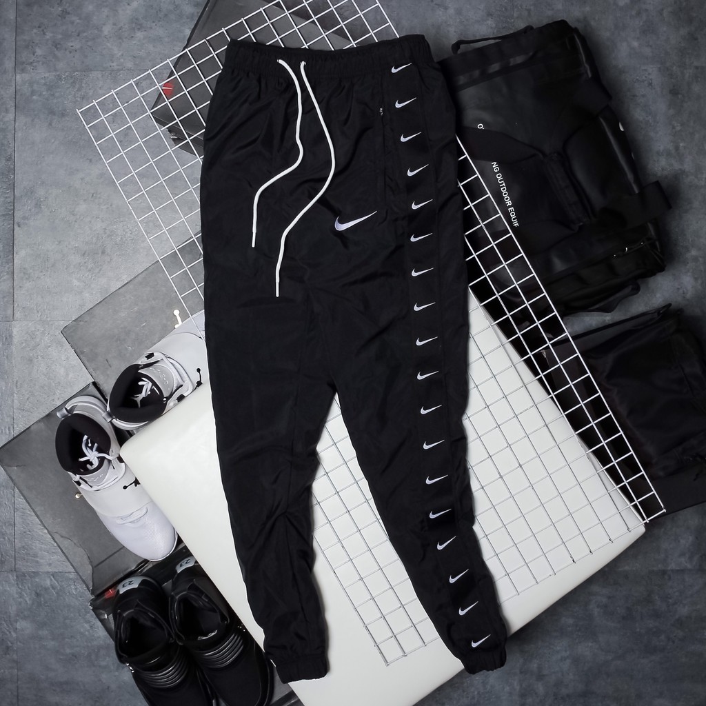 QUẦN DÀI NIKE SWOOSH TAPED SWOOSH POPOVER PANTS - ĐEN /TRẮNG
