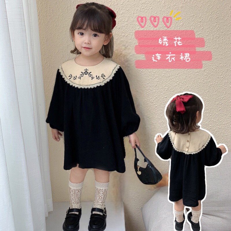 Váy baby doll thô đũi tằm đen thêu hoa cho bé