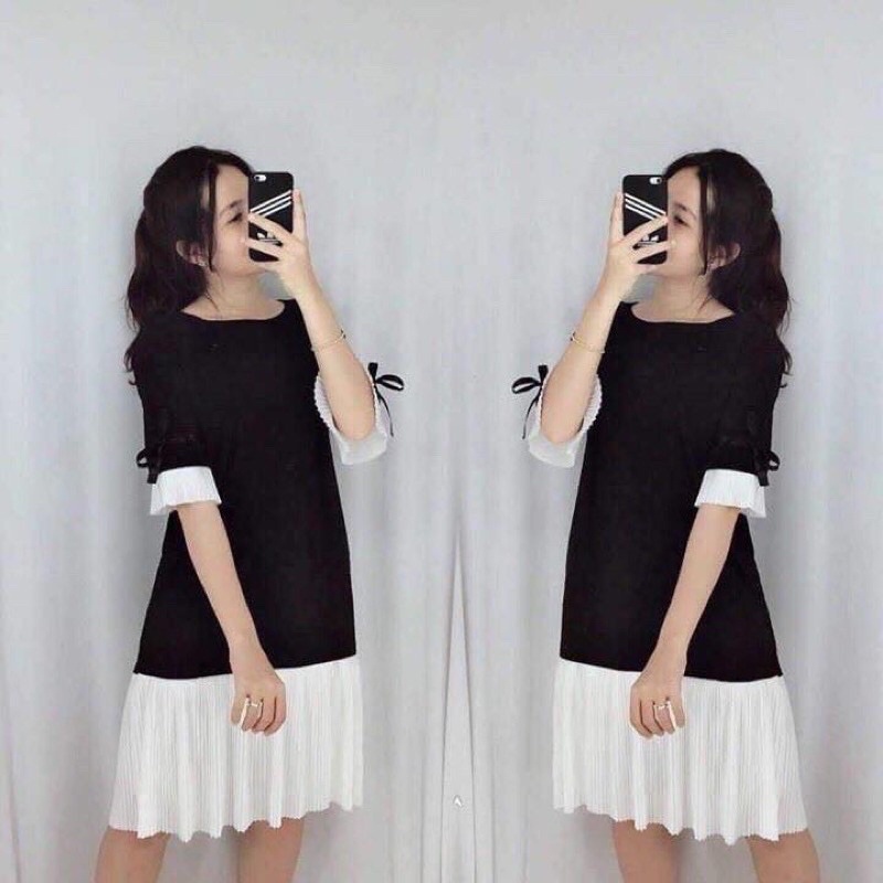 Đầm đen phối li tay ruy băng