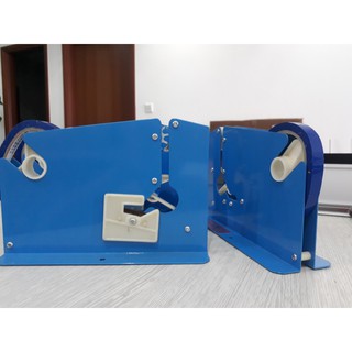 Máy buộc đầu túi trong siêu thị,buộc túi rau quả,túi bánh,túi nilong