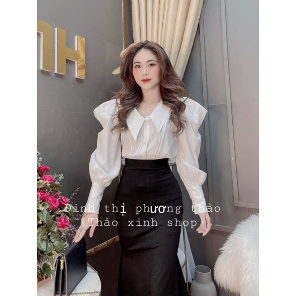 Áo sơ mi trắng tay bồng, chân váy đen ôm body đuôi cá