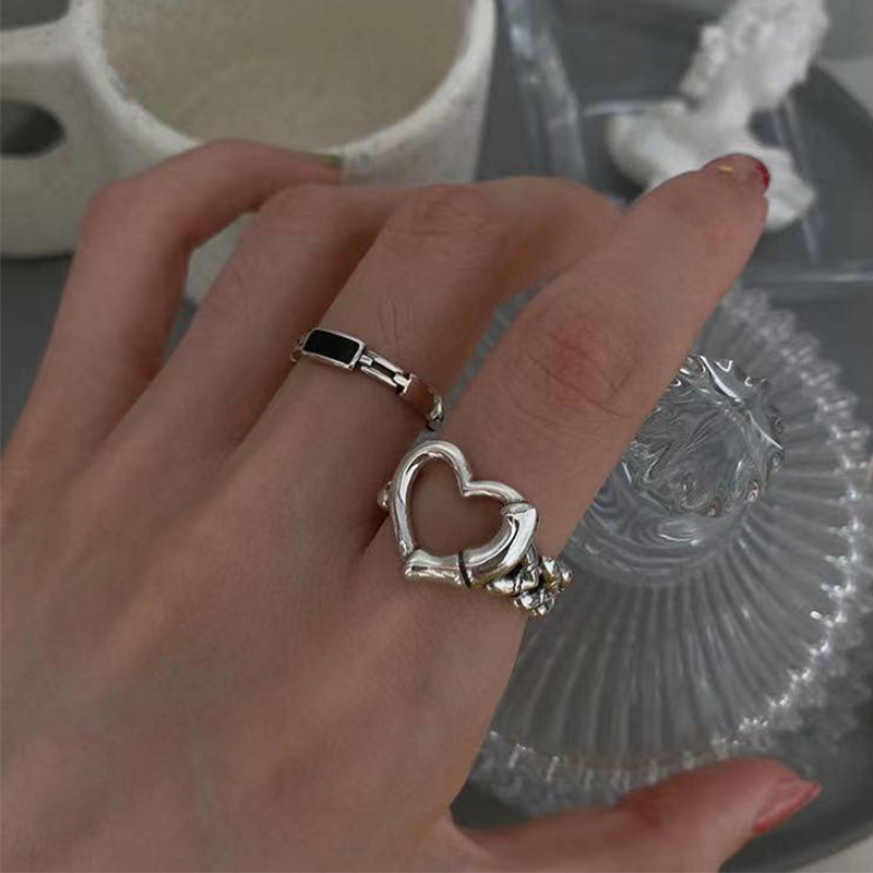 Bộ 2 chiếc nhẫn bằng kim loại có chiếc hình trái tim rỗng xinh xắn dành cho bạn nữ