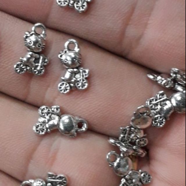 10 mặt xi bạc mèo ngồi xe đạp