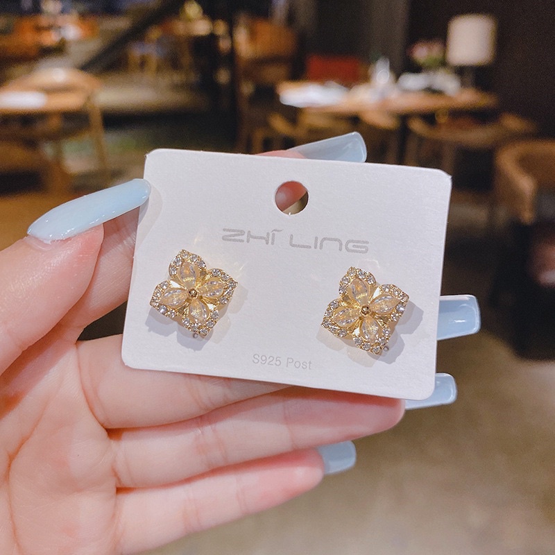 bông tai xoay xoay đính đá zircon, khuyên tai hoa 4 cánh phong cách hàn quốc