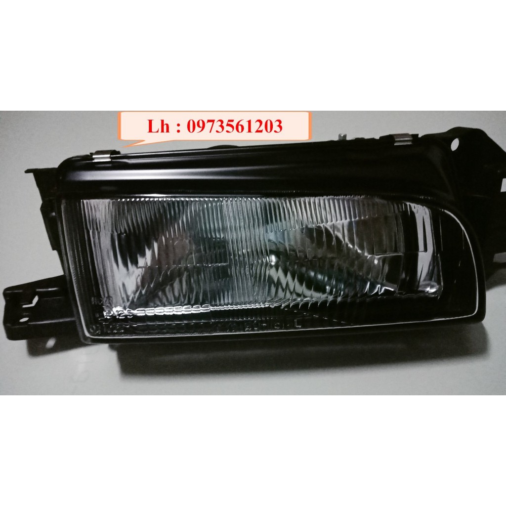 Đèn pha Mazda 323 đời 1995-1997 -tặng vòng xoay hương hoa