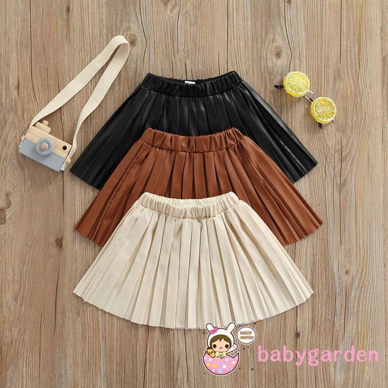 Chân váy da xếp ly lưng thun co giãn màu trơn dành cho bé gái