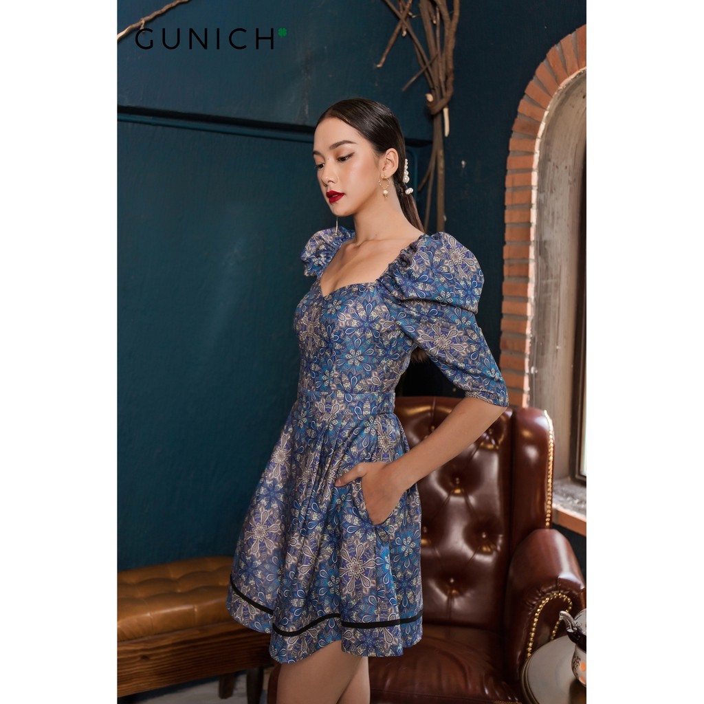 Đầm gấm họa tiết vạt đắp chéo Gunich
