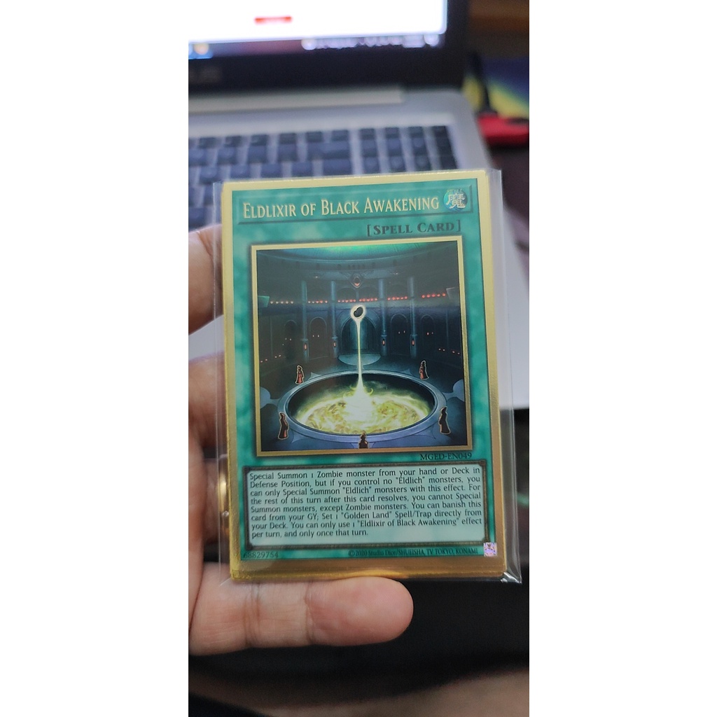 1 lá thẻ bài Eldlixir of Black Awakening - MGED-EN049 - Premium Gold Rare Tem Bạc