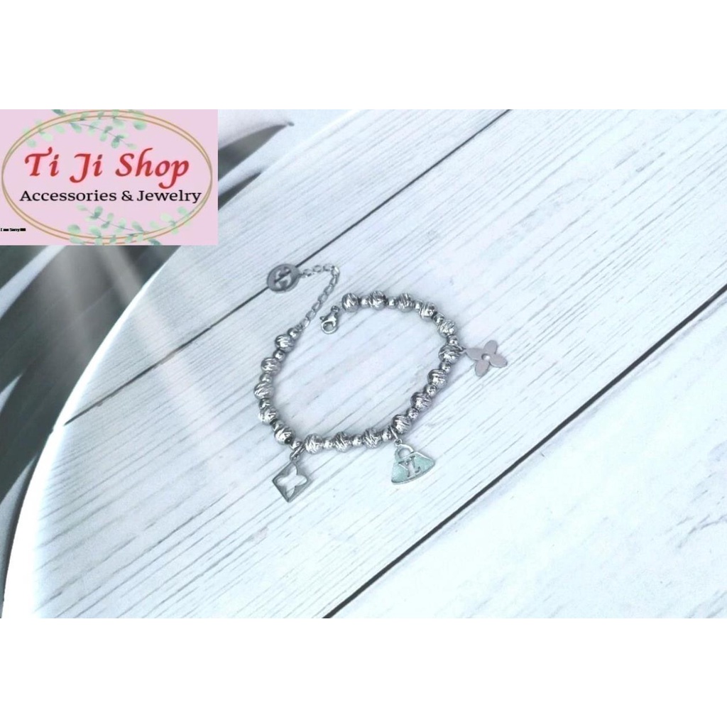 LẮC TAY NỮ BI INOX GẮN PHỤ KIỆN