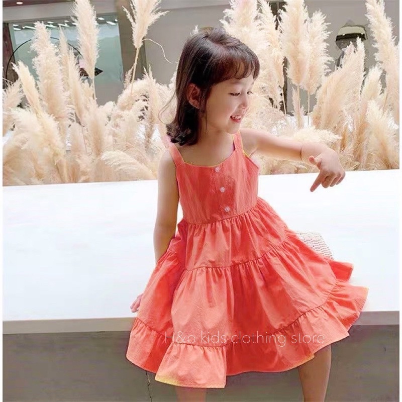 Váy vàng cam xoè tầng cho bé gái