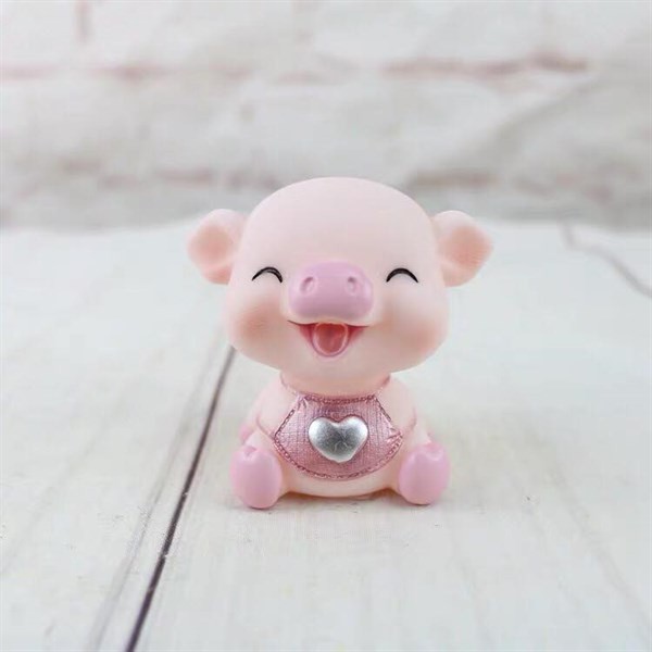 Đồ chơi trang trí lợn hồng cười (con)