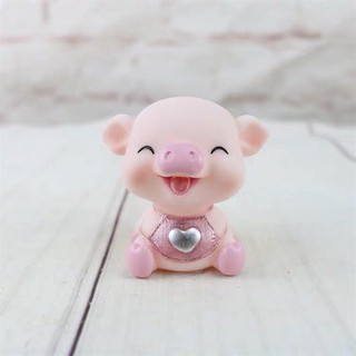 Đồ chơi trang trí lợn hồng cười (con)