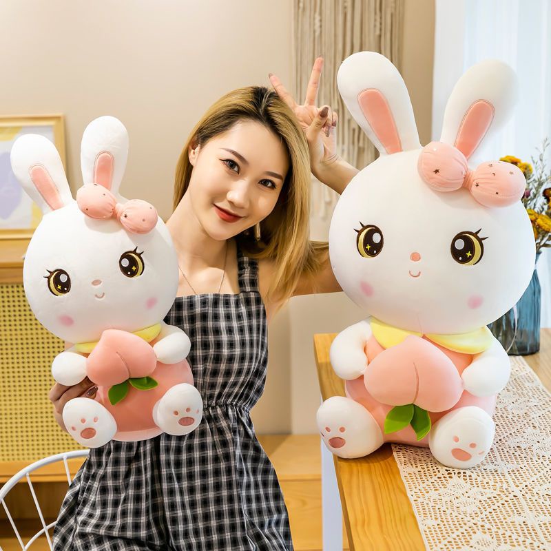 Gấu bông thỏ hồng, thỏ tai dài nhồi bông ôm trái đào vải miniso cao cấp - Unishop