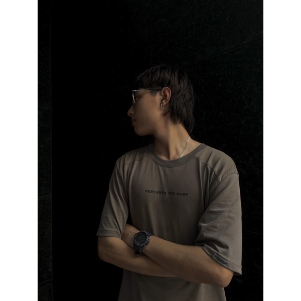 Áo Thun Unisex TeeHolic Thả Vai Xẻ Tà Màu Nâu In Logo THS Silicon Nổi