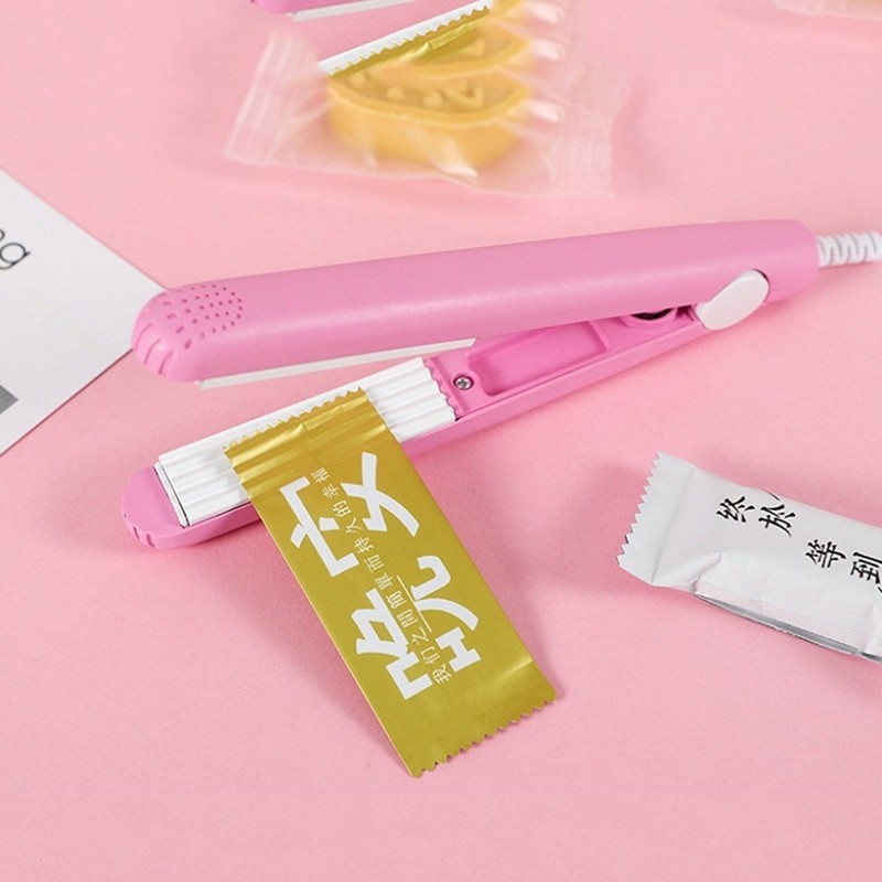 Máy hàn túi kẹo nougat,túi bánh,dập uốn tóc