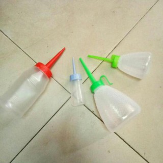 Lọ đựng dầu máy- ko có dầu, chỉ có lọ