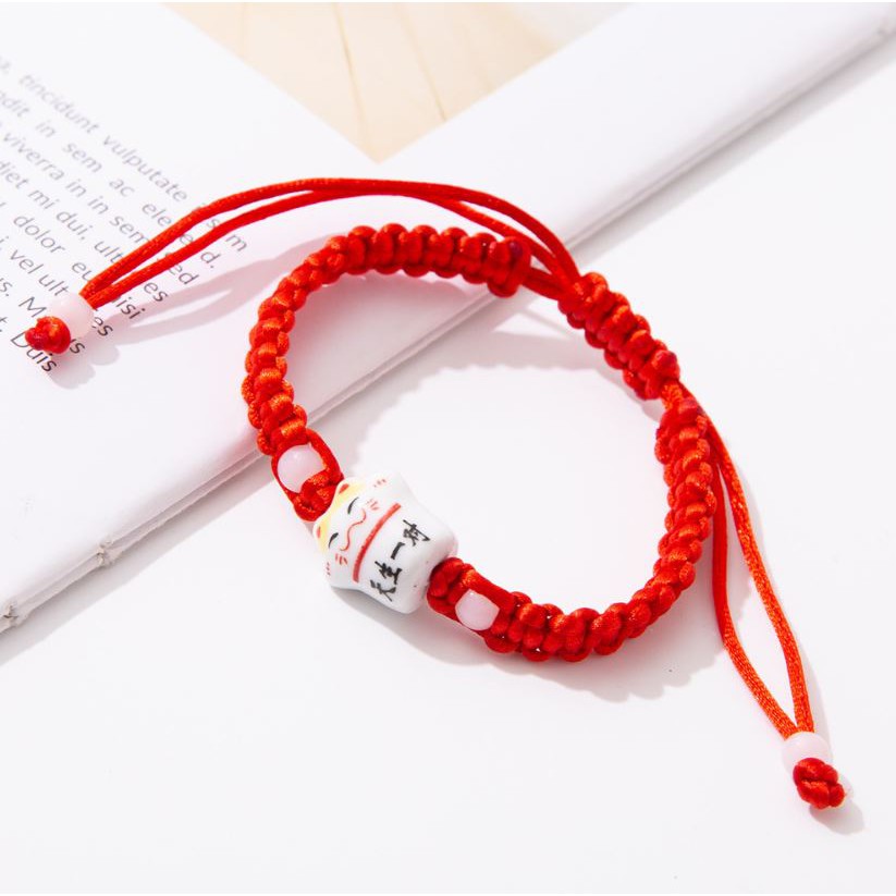 Vòng Tay EBI Gốm Mèo Chiêu Tài Maneki Neko Dây Rút Đỏ