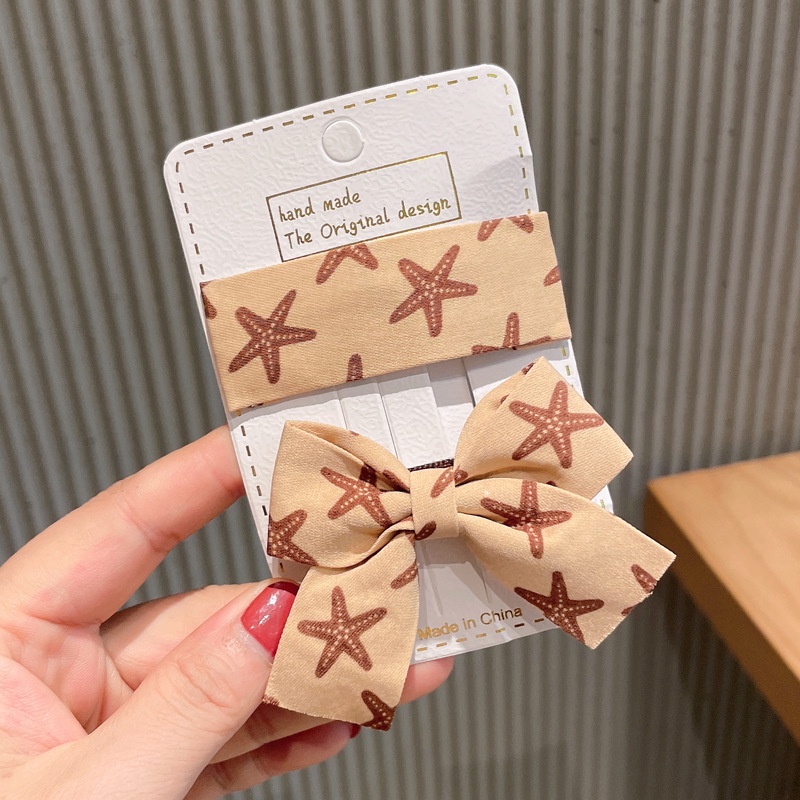 Kẹp tóc bb dáng vuông và nơ buộc làm từ vải họa tiết sao biển bắt mắt