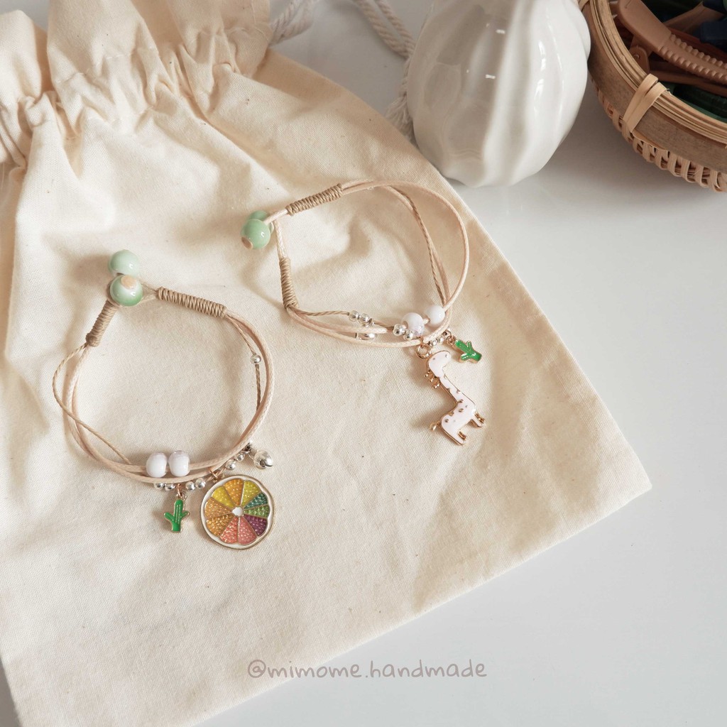 Vòng gốm nút gài phối charm màu xinh xắn