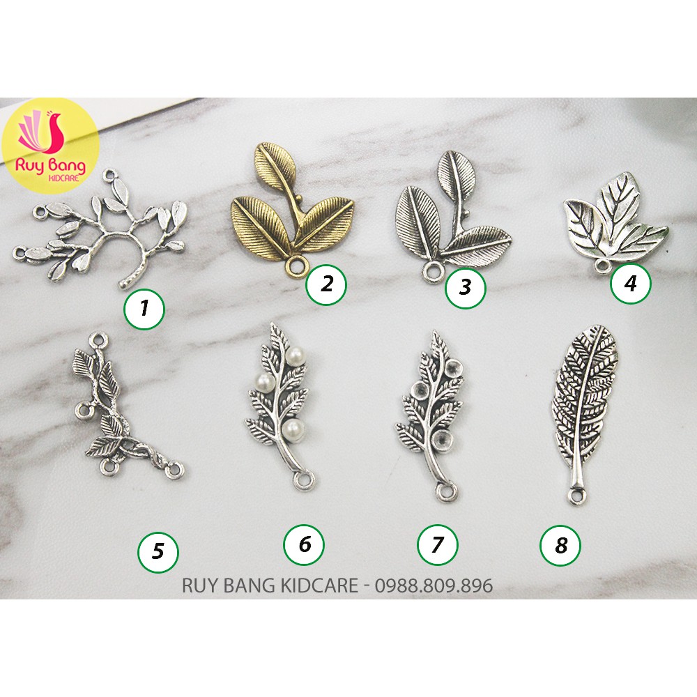 Cành lá kim loại, center đá đính hoa vải handmade