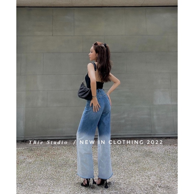 Quần jeans loang rách