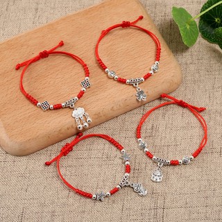 Vòng tay dây rút chỉ đỏ