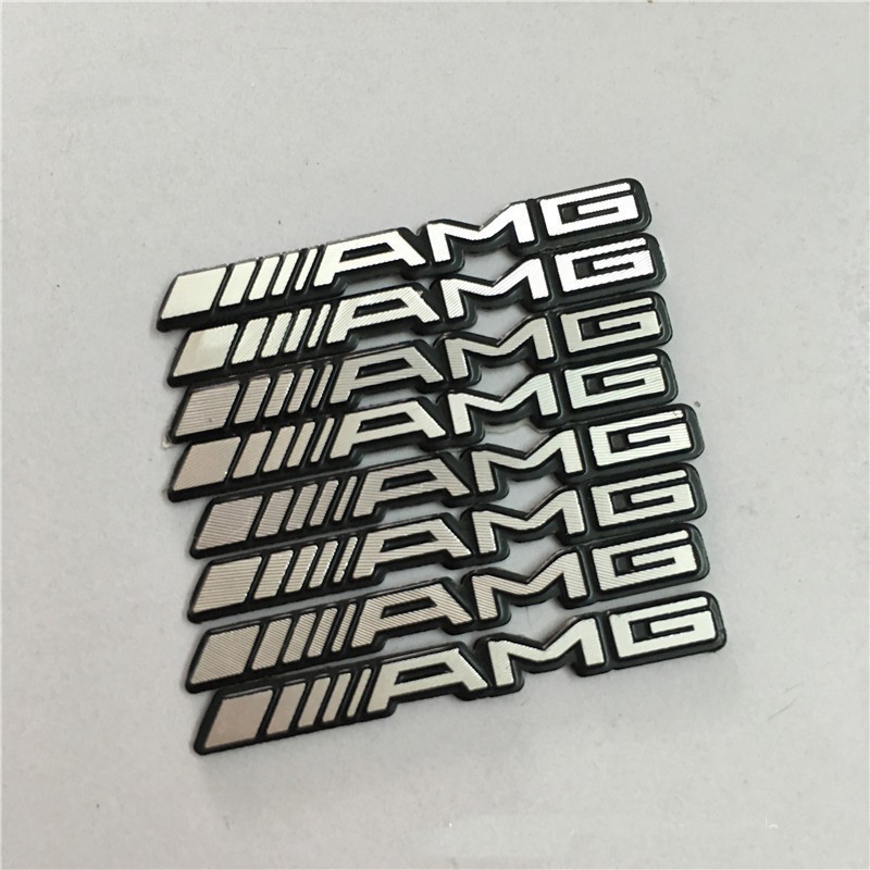 Set 2 logo AMG dán vô lăng xe hơi Mercedes