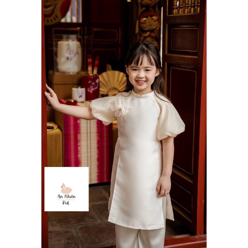 Áo dài bé gái chất liệu Tacta thiết kế tay bông nơ ngực