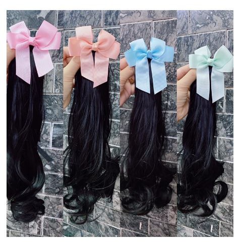 Kẹp tóc nơ xoăn dài cho bé