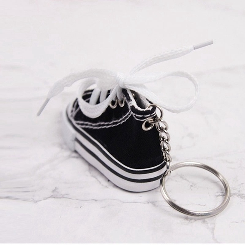 Móc khóa hình giày sneaker mini vải canvas tích hợp công dụng đệm lót chân chống xe đạp và xe máy