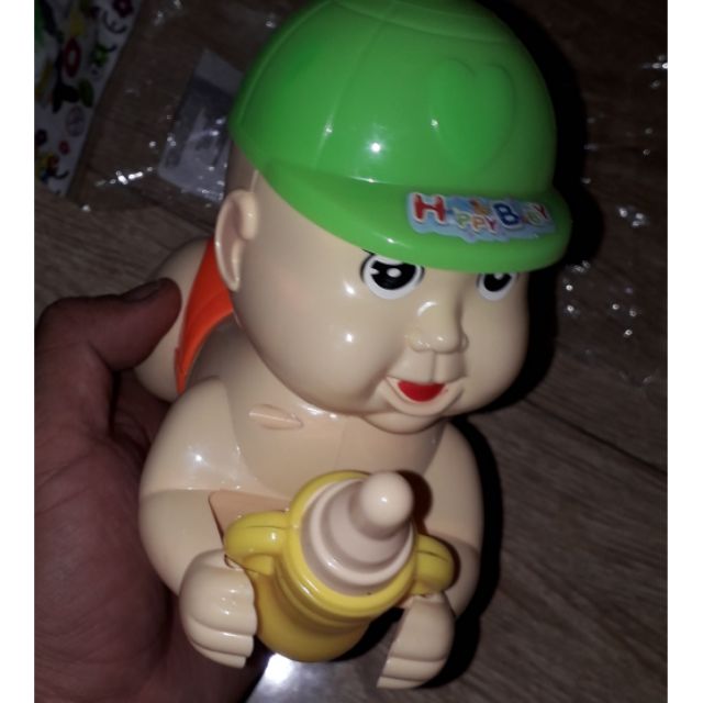 Em bé bò chạy dây rút có đèn Led bằng nhựa