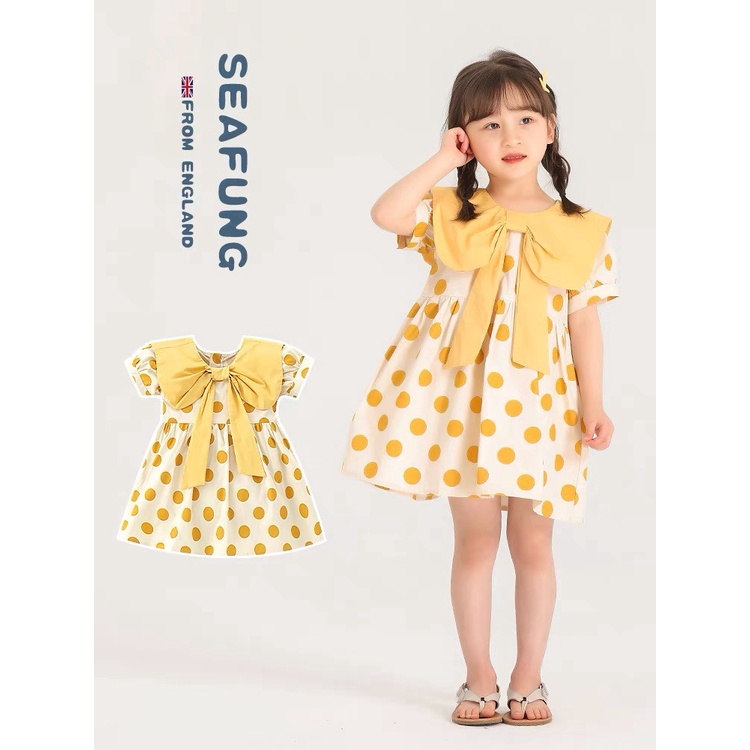 Váy chấm bi vàng cổ nơ cho bé gái chất đũi mềm mát và thấm mồ hôi