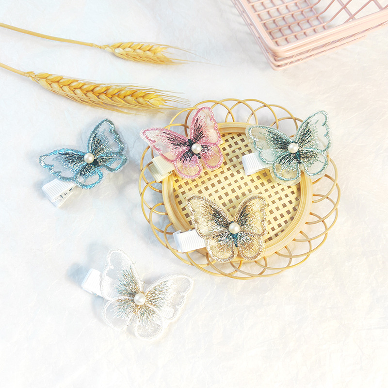 Kẹp tóc hình bướm đính hạt ngọc trai thời trang