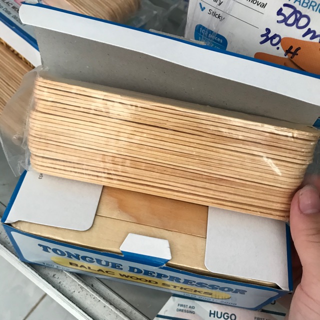 Que đè lưỡi gỗ