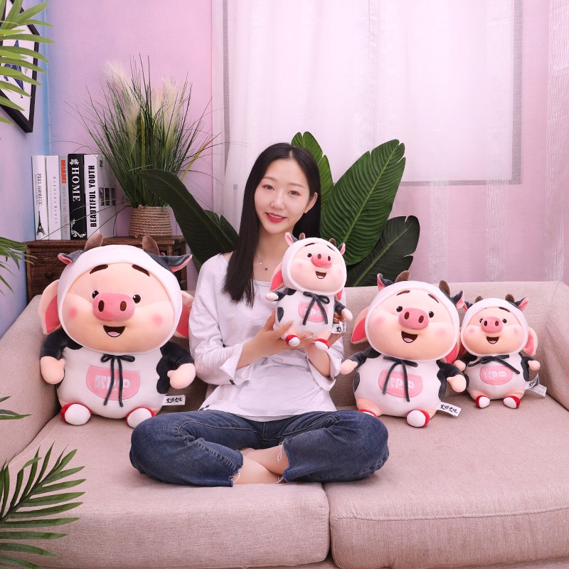 Thú bông heo tik tok mang áo bò sữa